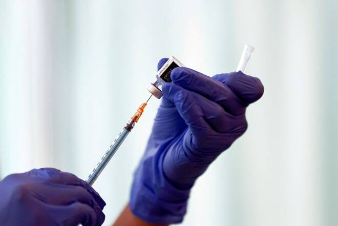 A medical worker fills a syringe with a dose of the Pfizer-BioNTech coronavirus disease (COVID-19) vaccine as Japan launches its inoculation campaign, at Tokyo Medical Center in Tokyo