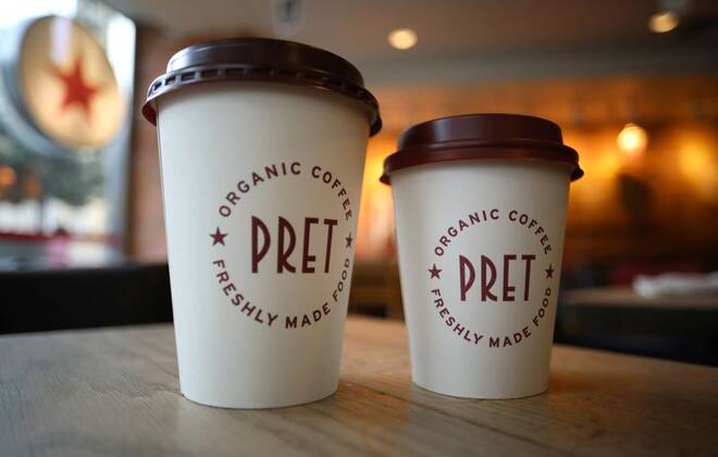 Take-away coffee cups stand on a table inside a Pret A Manger store in Liverpool