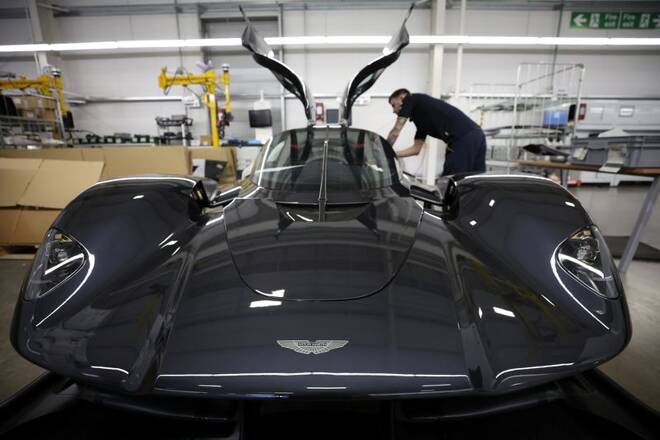 An employee works on the interior of an Aston Martin Valkyrie car at the company’s factory in Gaydon