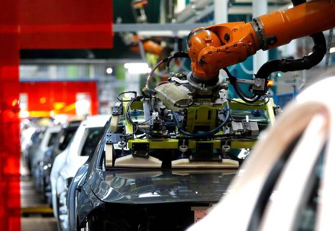 A robot adjusts a windscreen in a fully automated process on a model of the A-class production line of German car manufacturer Mercedes Benz at the Daimler factory in Rastatt