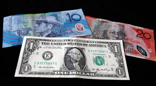 A US dollar note is pictured alongside Australian dollars in this picture illustration taken in Washington