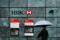 A man walks past a HSBC bank branch in the City of London