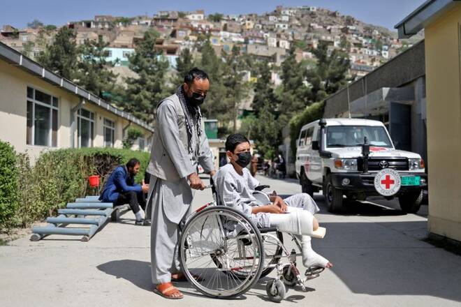 Ahmad Zia is seen with his uncle at the Red Cross rehabilitation center in Kabul
