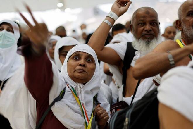 Muslim pilgrims cast their stones at a pillar symbolising the stoning of Satan during the annual Haj pilgrimage in Mina