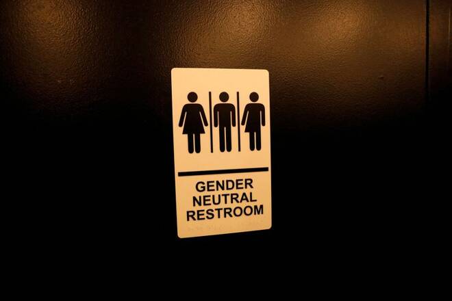A sign is seen on a gender neutral restroom wall in New York City