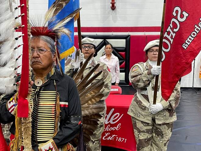 U.S. Interior Secretary Deb Haaland stands behind a Native American color guard ahead of an event in Anadarko, Oklahoma
