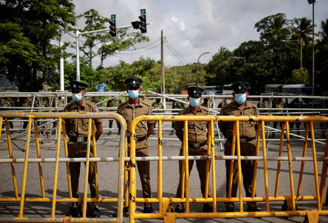 Security personel patrol in the premises of Sri Lanka's Parliament building, in Colombo