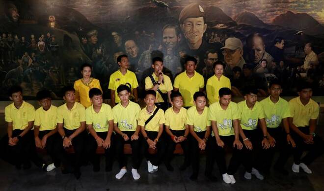 Members of the Wild Boars soccer team return one year after their rescue from the caves in Tham Luang