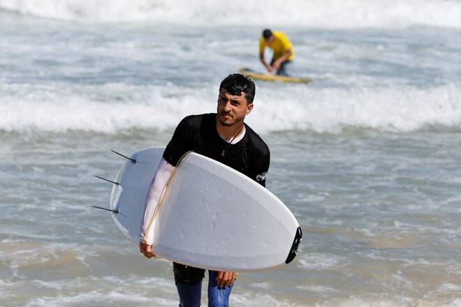 With eyes on the waves, Gaza surfers keep boards handy in Gaza