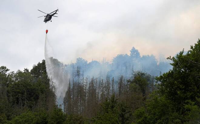Helicopters attend a forest fire