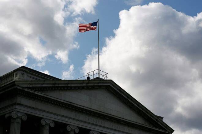 The United States flag flies atop the U.S. Treasury Department in Washington