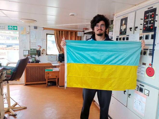 Burak Kinayer, deck cadet of the Turkish-flagged cargo ship Kaptan Cevdet, poses at a ship in Odesa