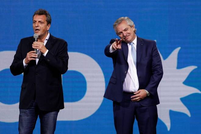 Argentina's President Alberto Fernandez gestures as Sergio Massa speaks after midterm elections, in Buenos Aires