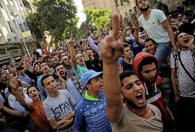 Egyptian protesters and Muslim Brotherhood members shout slogans against President Abdel Fattah al-Sisi and government during a demonstration protesting the government's decision to transfer two Red Sea islands to Saudi Arabia, in front of the Press Syndic