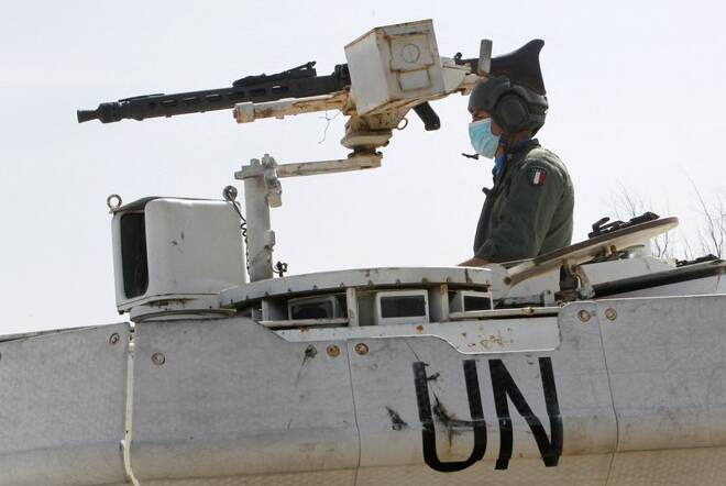 A UN peacekeeper (UNIFIL) sits in a UN armoured vehicle in Naqoura, near the Lebanese-Israeli border