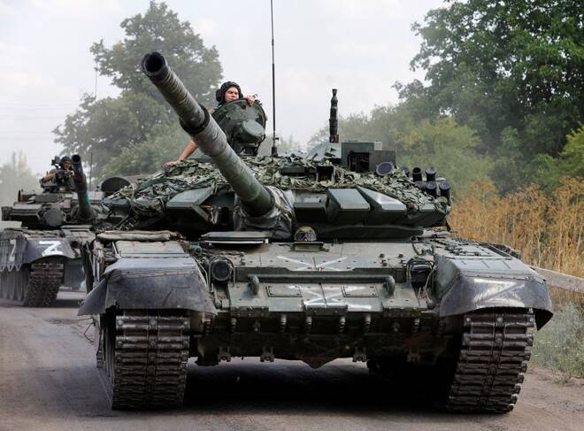 Service members of pro-Russian troops drive tanks in the course of Ukraine-Russia conflict near the settlement of Olenivka