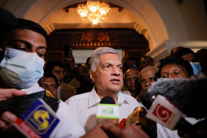 FILE PHOTO - Ranil Wickremesinghe who has been elected as the Eighth Executive President under the Constitution arrives at a Buddhist temple