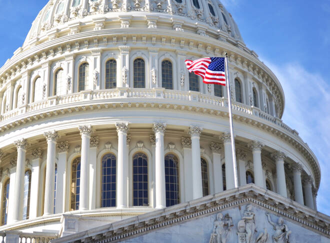 Capitol Hill building alongside US flag