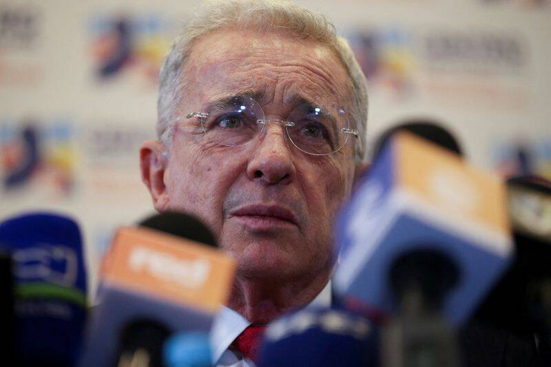 Colombia's former president Alvaro Uribe reacts to the media after his meeting with President-elect Gustavo Petro in Bogota