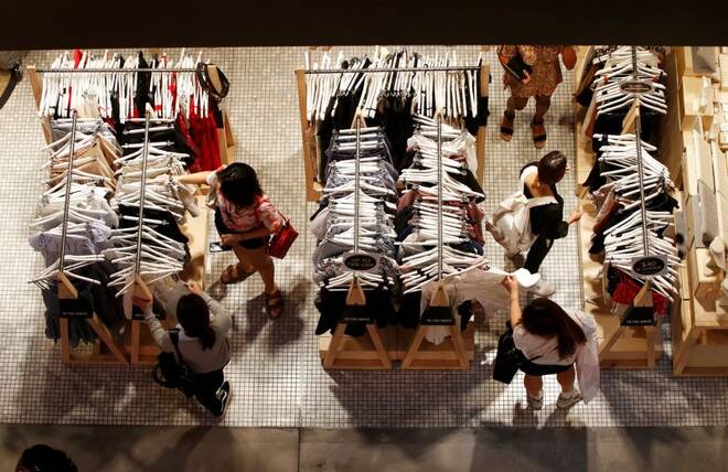 Women shop for clothes on a store in a shopping mall in Sydney