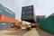A mobile crane carries a container at Thar Dry Port in Sanand in the western state of Gujarat, India