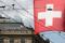 Switzerland's national flag flies in front of the headquarters of Swiss bank Credit Suisse in Zurich
