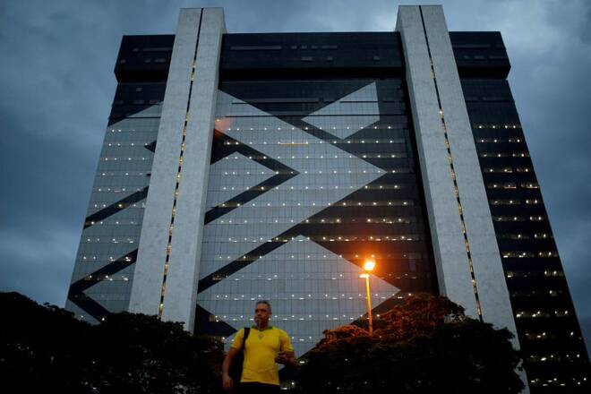 A man walks in front of Banco do Brasil headquarters building in Brasilia