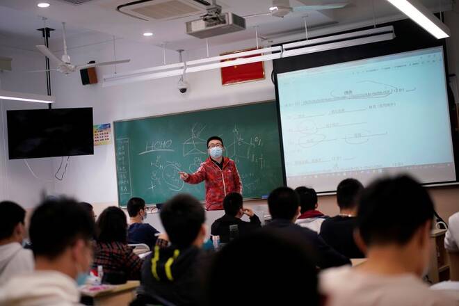 Teacher teaches inside a classroom at a high school in Shanghai