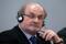 Author Rushdie listens during the opening news conference of the Frankfurt book fair