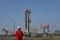 Workers are seen near pumpjacks at a CNPC oil field in Bayingol