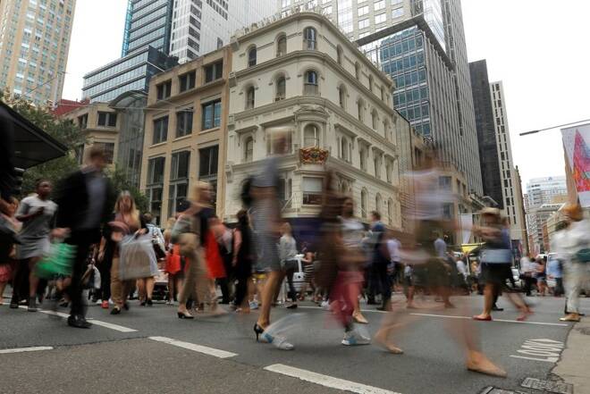 Office workers walk the streets of Sydney, Australia