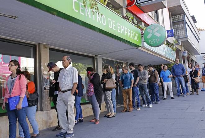 People wait at the employment center to open in Sintra