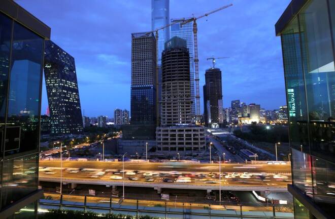 Vehicles drive through Beijing's central business area