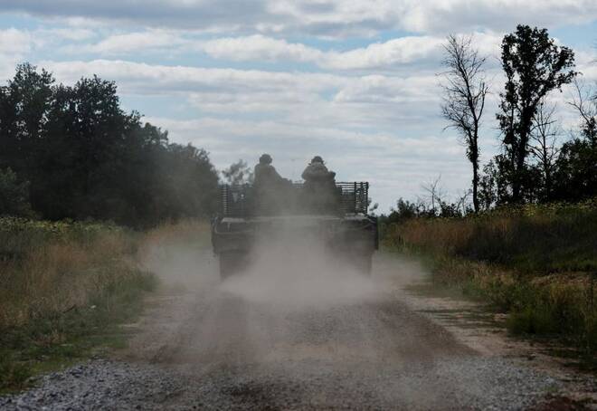 Ukrainian servicemen drive near Bakhmut, Donetsk region