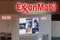 Logos of ExxonMobil are seen in its booth at Gastech, the world's biggest expo for the gas industry, in Chiba