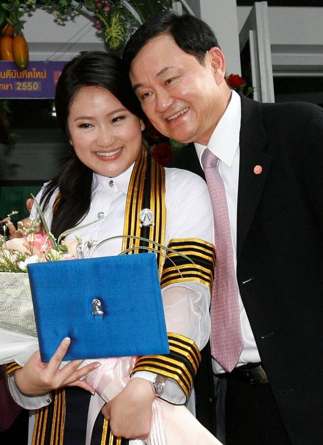 Ousted Thai PM Thaksin poses with his daughter Paetongtarn during her graduation day at a Bangkok university