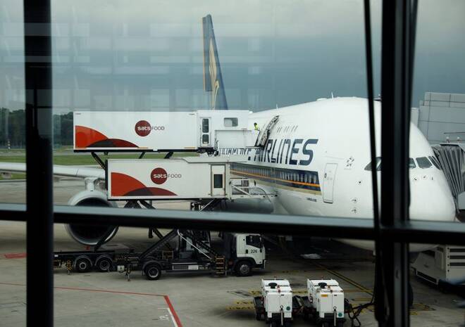 SATS Food Services restock a Singapore Airlines plane at Changi Airport in Singapore