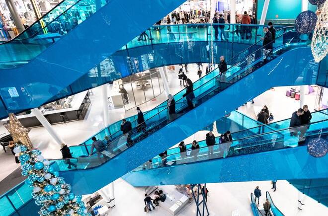 Christmas shoppers maintain social distancing as they ride on escalators in Emporia shopping centre in Malmo