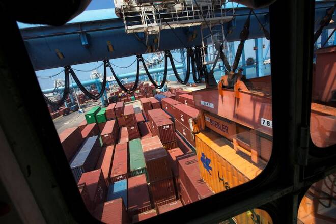 Containers are seen through the window of a crane operator's booth at the port of the northern city of Haifa