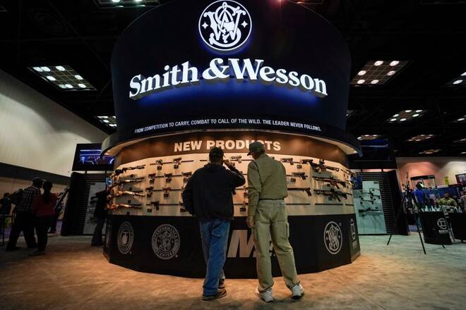 Attendee inspect Smith and Wesson rifles at the National Rifle Association's (NRA) annual meeting, in Indianapolis, Indiana
