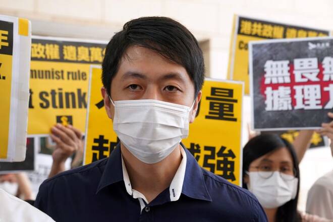Former pro-democracy lawmaker Ted Hui Chi-fung appears outside West Kowloon Magistrates' Courts in Hong Kong