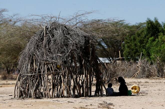 Children affected by the worsening drought due to failed rain seasons, sit outside their makeshift shelter at Sopel village in Turkana