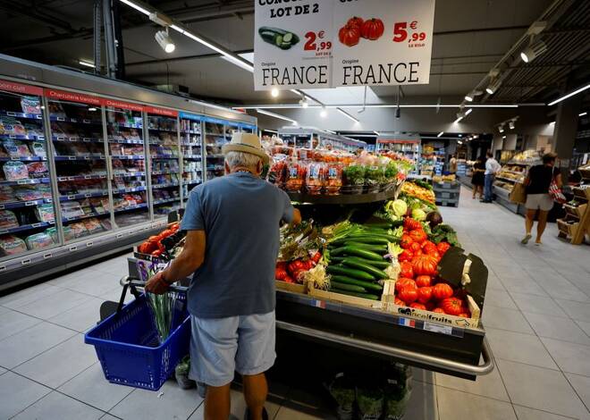 A customer shops in a supermarket in Nice