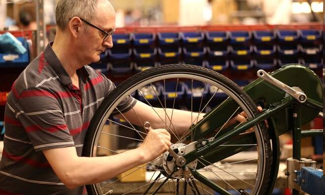 A worker assembles a new bike at the Pashley bicycle factory in Stratford-upon-Avon