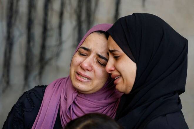 Relatives of Palestinian Basil Basbous killed by Israeli forces in an incident react in Jalazone refugee camp, in the Israeli-occupied West Bank