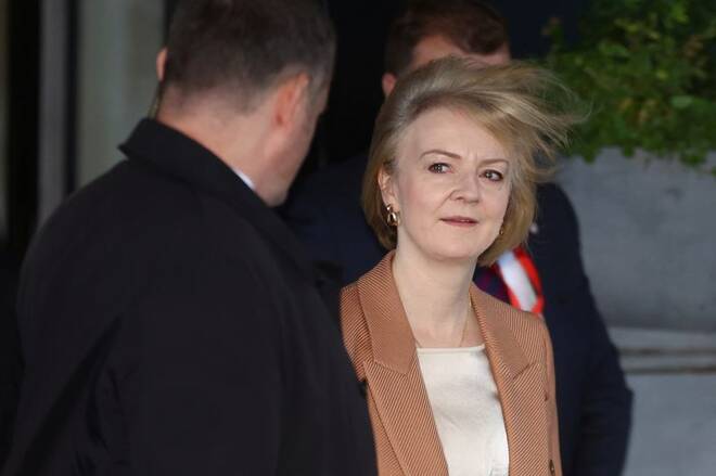 British Prime Minister Liz Truss walks outside her hotel in Birmingham
