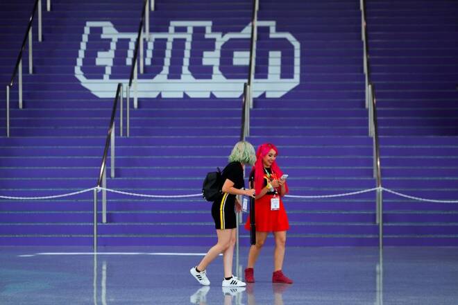 A Twitch logo is displayed at a video games expo