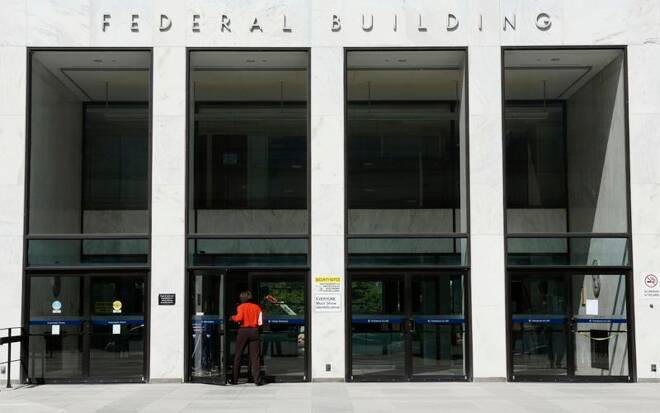A worker enters a transportation department federal building in Washington