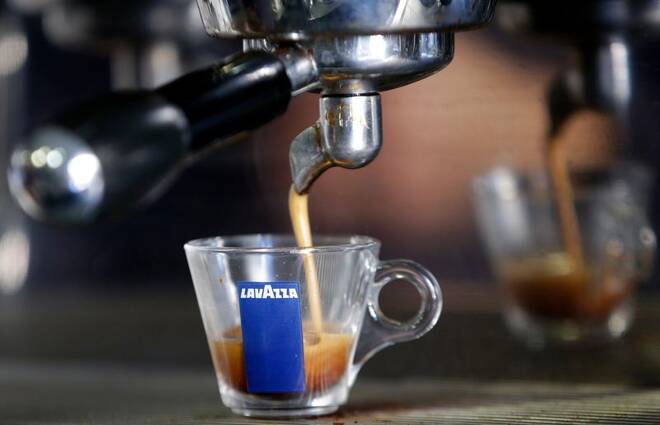 Coffee flows into a Lavazza cup at a coffee shop in Rome