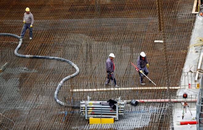 Workers are pictured at a construction site in Vienna